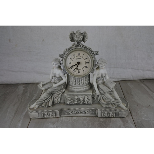 81 - A decorative mantle clock. Approx 26x29cm.