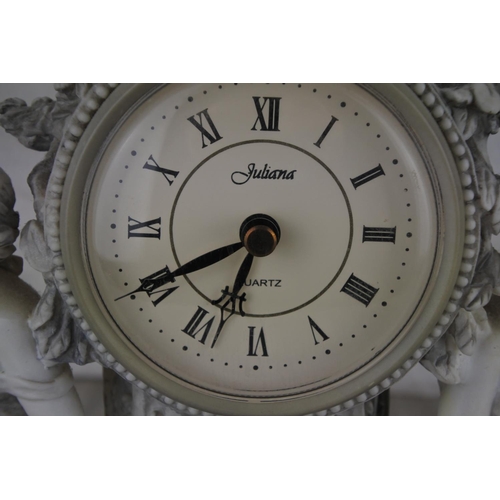 81 - A decorative mantle clock. Approx 26x29cm.