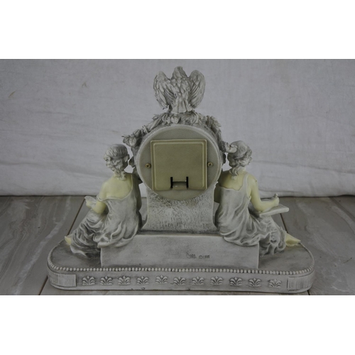 81 - A decorative mantle clock. Approx 26x29cm.