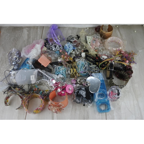 83 - A large assortment of costume jewellery.