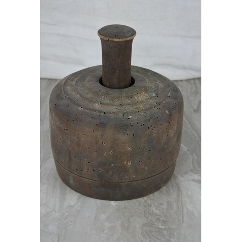 97 - A large antique butter press with decorative design.