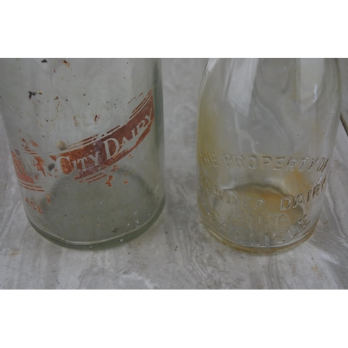 263 - Two vintage milk bottles 'The Old City Diary' and 'Border Dairy, Carlisle'.