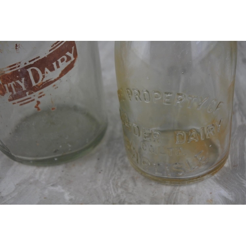 263 - Two vintage milk bottles 'The Old City Diary' and 'Border Dairy, Carlisle'.