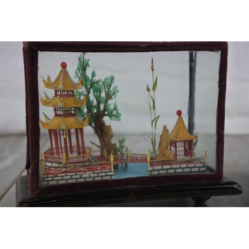 273 - Two stunning Oriental houses in glass presentation cases.