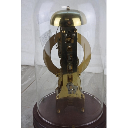 280 - A vintage skeleton mantle clock under a glass dome.  Approx 29cm.