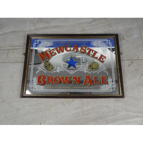 603 - A small vintage pub mirror 'Newcastle Brown Ale' Approx 32x22CM.