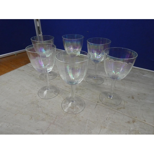 605 - A set of six iridescent wine glasses.