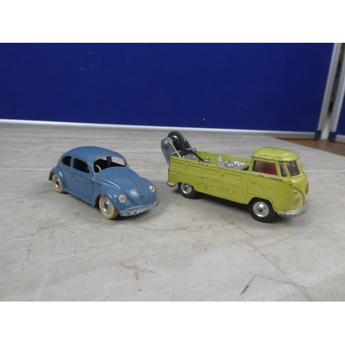 617 - A vintage Dinky toy car and a vintage Corgi Volkswagen.