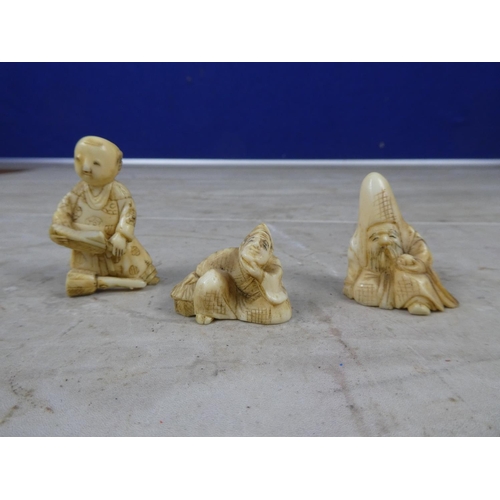 628 - Three Oriental figures.