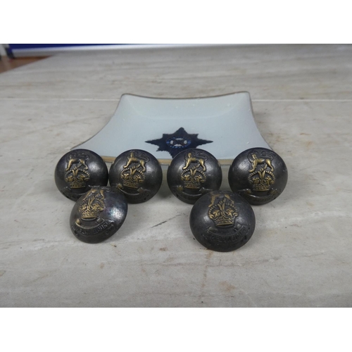 630 - Six military buttons and a glass dish.