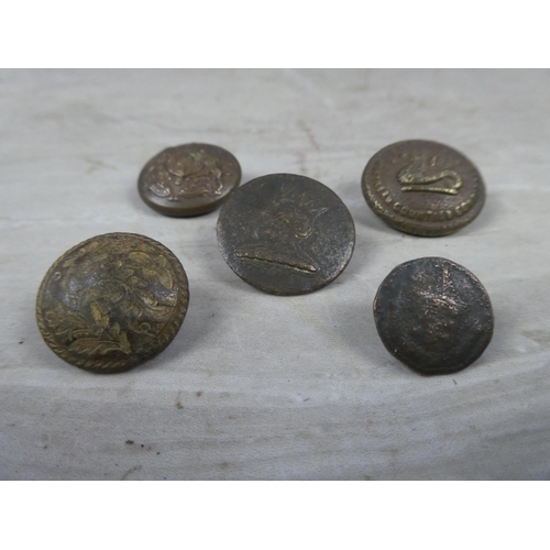 632 - Five antique military buttons.