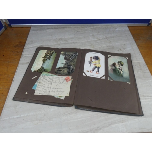 634 - A vintage postcard album and a lot of postcards to include Military, White Star Line, Cunard & other... 
