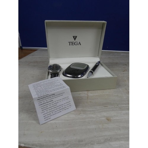 642 - A boxed gents Tega three piece gift set to include watch, calendar/calculator and pen.