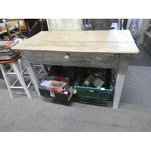 655 - An Irish pine kitchen table with slatted undershelf.