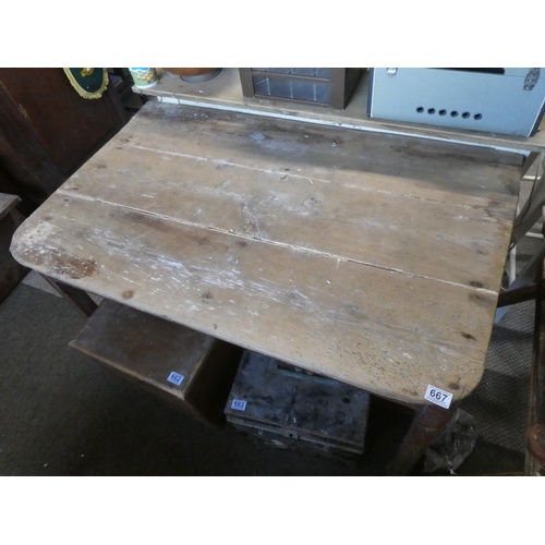 667 - An antique Irish pine kitchen table.