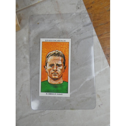 671 - A lot of vintage football annuals and books and a Sun Newspaper Soccercard no 262 Harry Gregg.