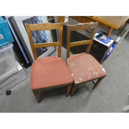 673 - A set of four vintage oak dining room chairs.