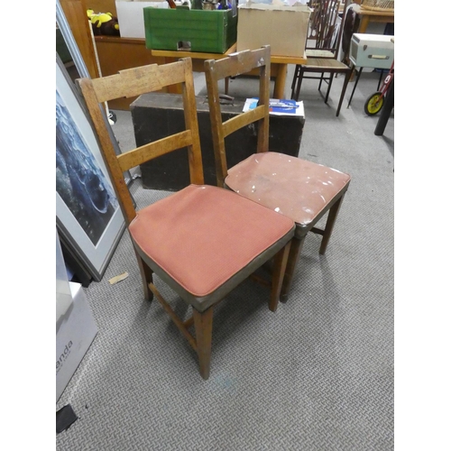 673 - A set of four vintage oak dining room chairs.