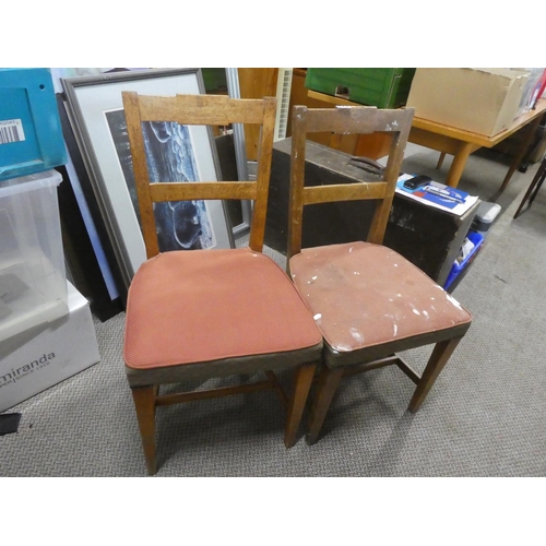 673 - A set of four vintage oak dining room chairs.