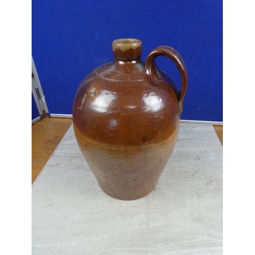 680 - An antique stoneware flagon.