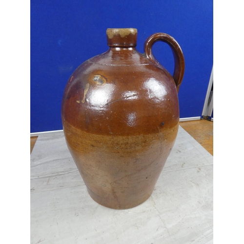 680 - An antique stoneware flagon.