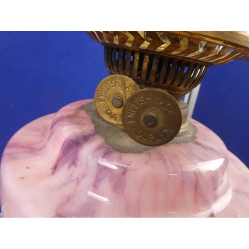 683 - A stunning antique oil lamp with pink marble font and clear glass shade.