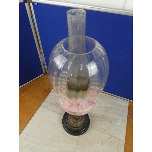 683 - A stunning antique oil lamp with pink marble font and clear glass shade.