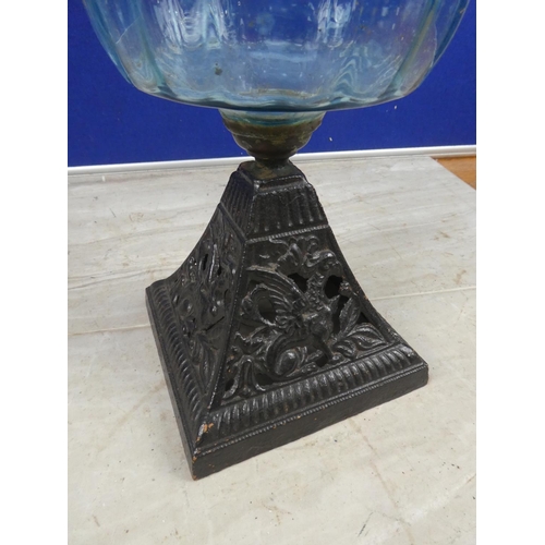 684 - An antique cottage oil lamp with blue glass font.