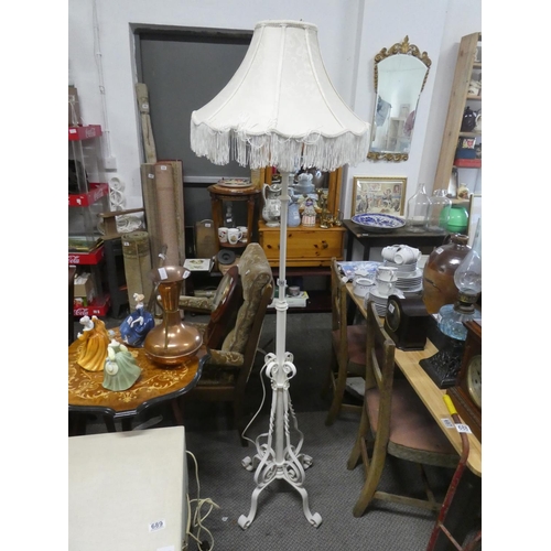 690 - An antique style standard lamp base and shade.