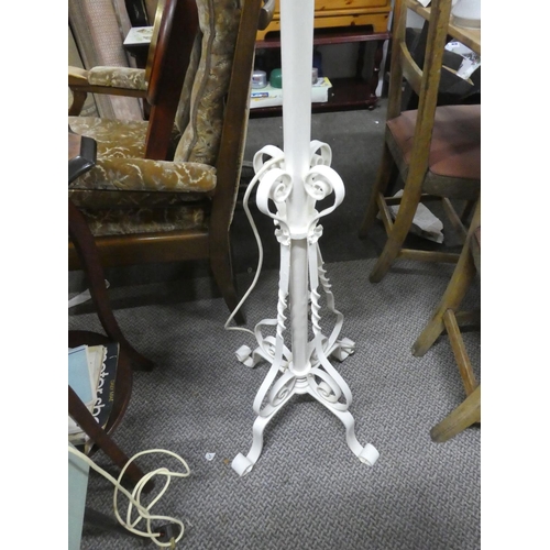 690 - An antique style standard lamp base and shade.