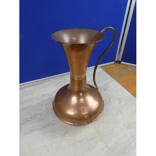 691 - A vintage copper jug.