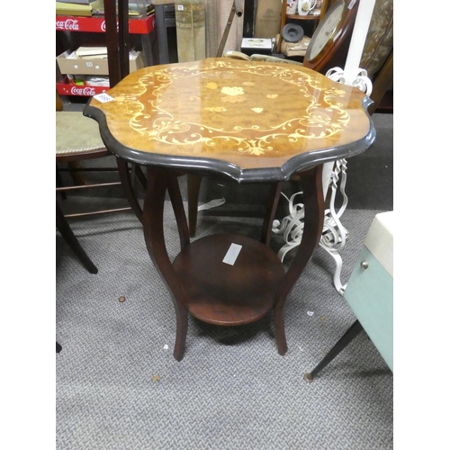 695 - A decorative topped occasional table with undershelf.