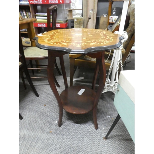 695 - A decorative topped occasional table with undershelf.