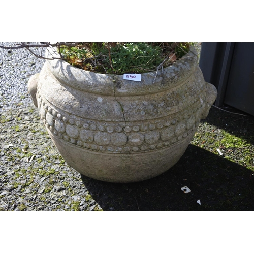 1150 - A large concrete planter.