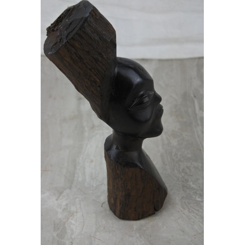 221 - A carved wooden African head. Approx 22cm.