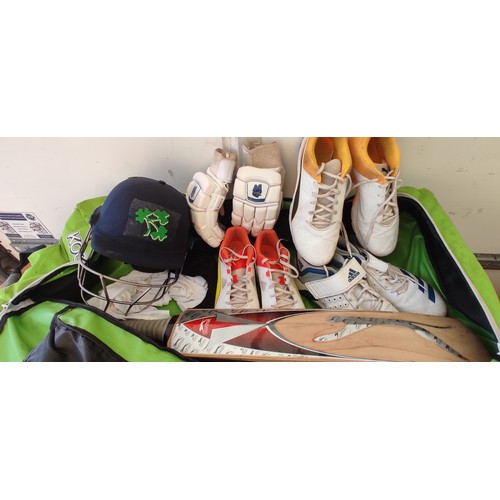 564 - An assortment of cricket equipment to include two size 10's and one size 11 cricket shoes.