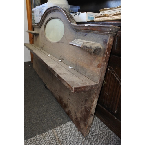 566 - A mahogany sideboard back panel with oval mirror for restoration. Approx 128x75x15CM.