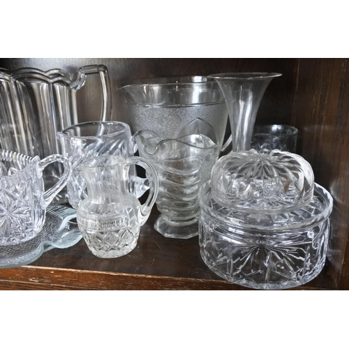 585 - A large collection of glass jugs and more.