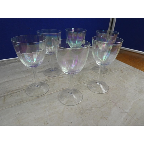 605 - A set of six iridescent wine glasses.