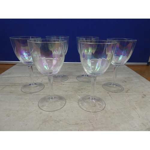 605 - A set of six iridescent wine glasses.