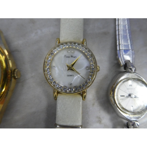 631 - Three ladies wrist watches and another.