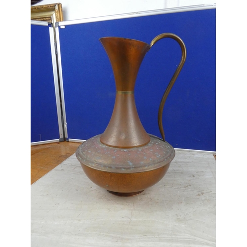 649 - A large copper jug.