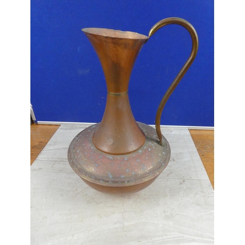 649 - A large copper jug.