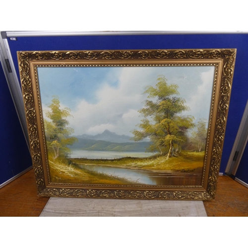 1028 - A painting of a mountain scene in gilt frame, signed Jackson.