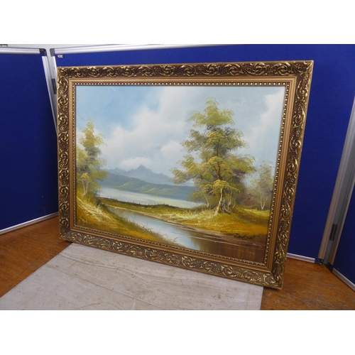 1028 - A painting of a mountain scene in gilt frame, signed Jackson.