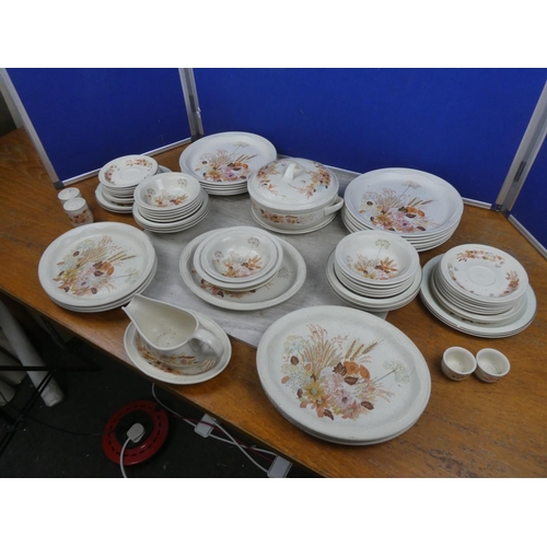 1043 - A large assortment of Poole Pottery ceramics.