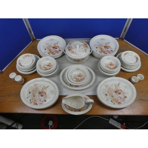 1043 - A large assortment of Poole Pottery ceramics.