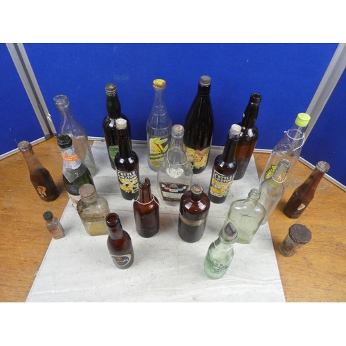 1098 - An assortment of vintage glass bottles.