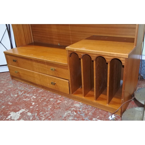 1120 - A large teak display and storage cabinet.