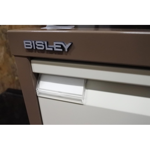 1124 - A four drawer 'bisley' filing cabinet.